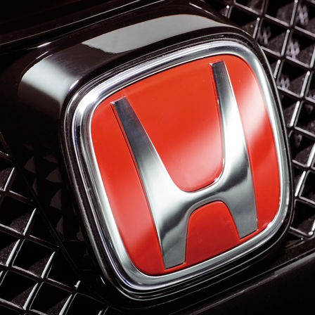 Close up of the Honda red 'H' logo.
